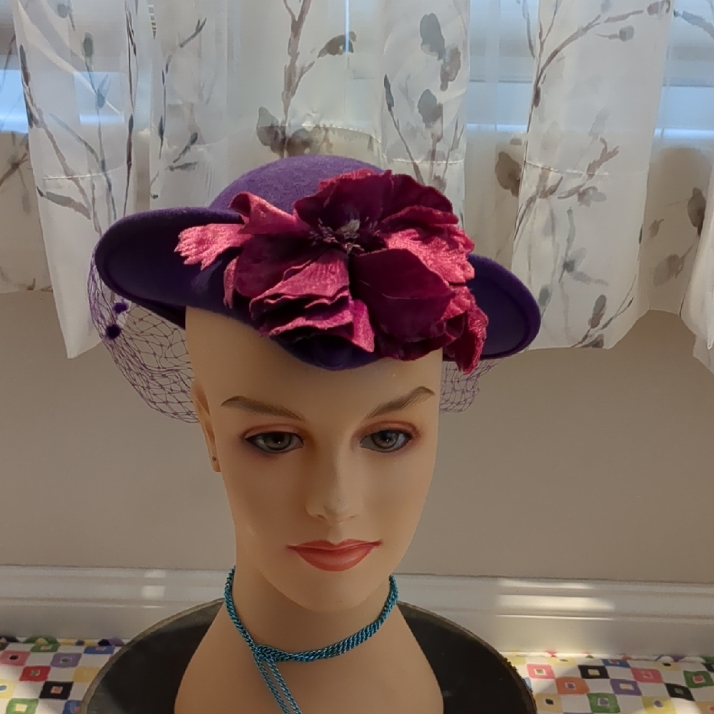 purple ventage hat with floral accent and veil